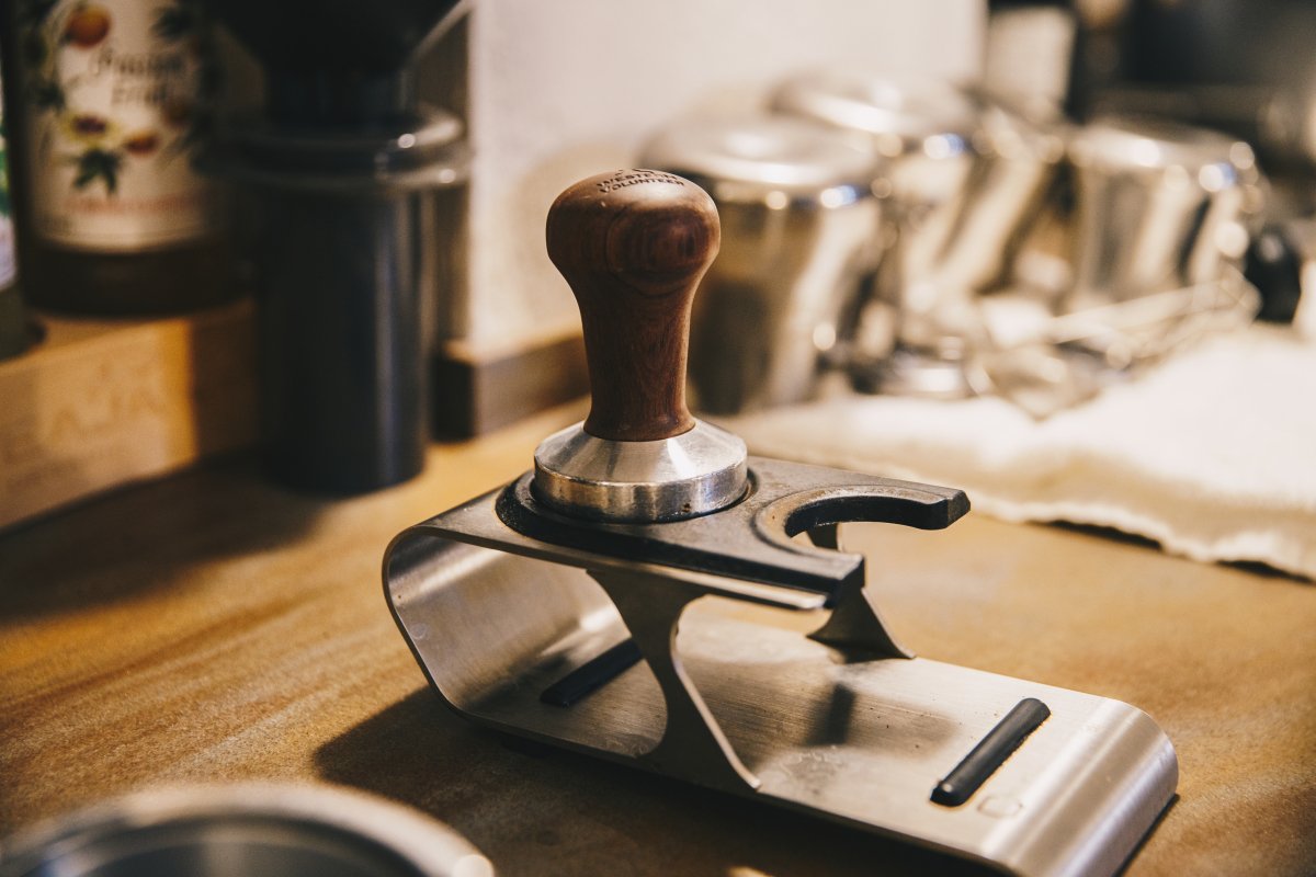 metal coffee tamp on stand